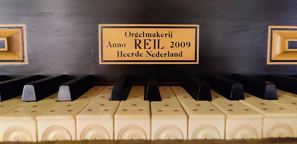 The builder's plate above the keys of the organ in St Nikolaus, Rosenehim.