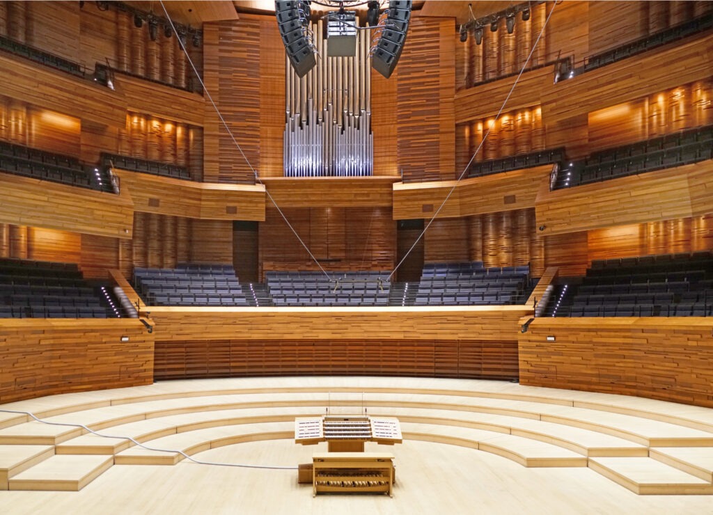 The stage area of the Grand Auditorium of the Maison de la Radio et de la Musique, Paris, showing the mobile console and, behind, the Grenzing organ.